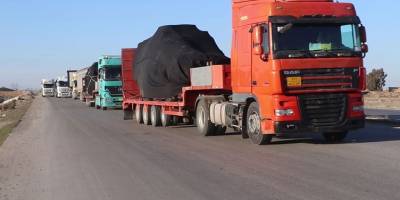 Uluslararası Koalisyon, Rojava'ya 76 kamyon ve askeri araç gönderdi